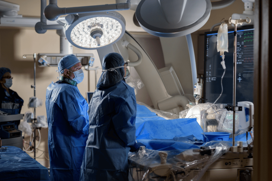 Dr. Jeffrey Stewart and team care for a patient in the cardiac cath lab.