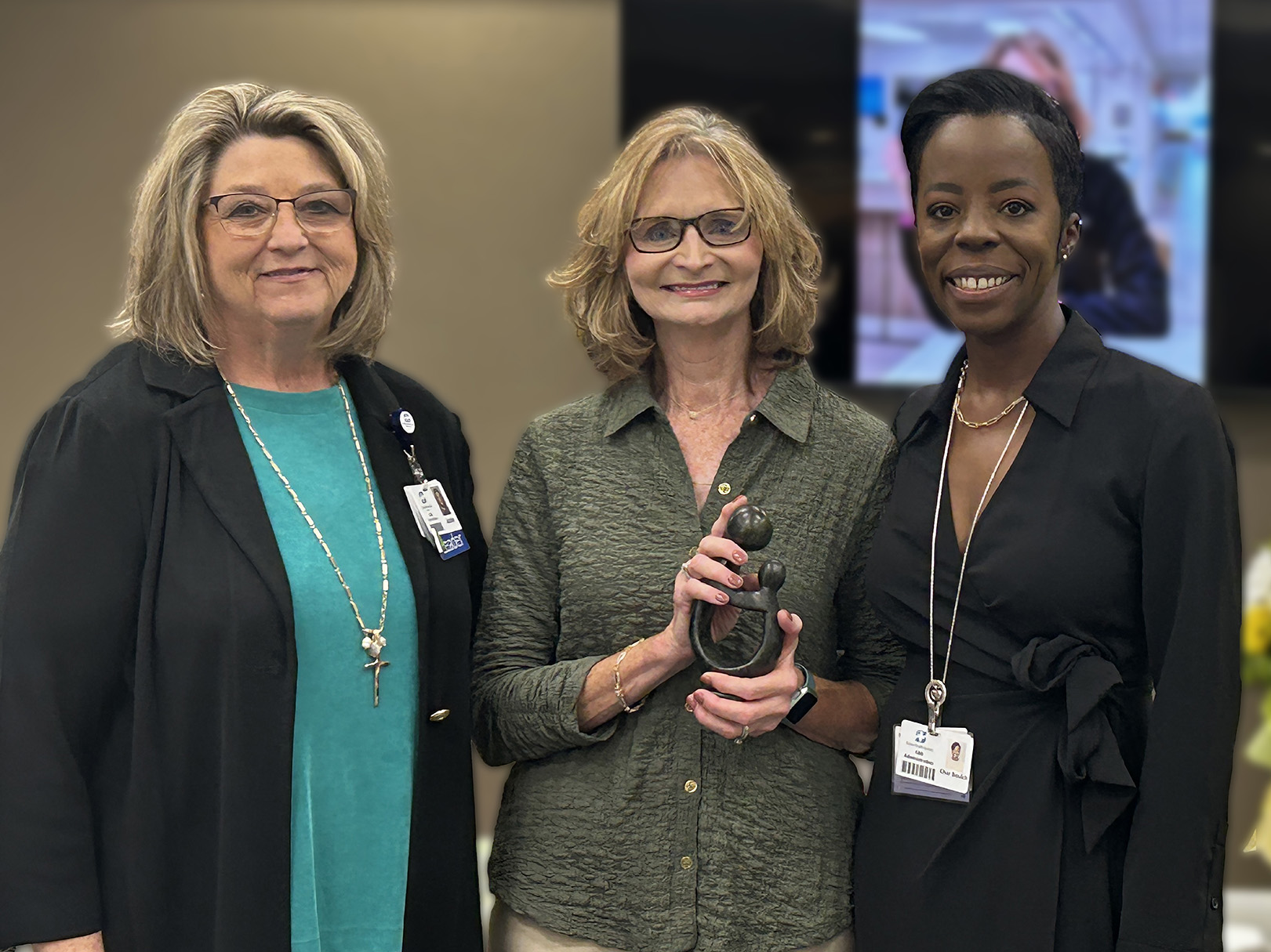 Jackie and Char presented Tracy Goodwin with the traditional "Healer's Touch" sculpture